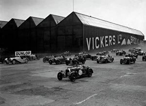 Racing Car Gallery: Cars racing at the MCC Members Meeting, Brooklands, 10 September 1938. Artist: Bill Brunell