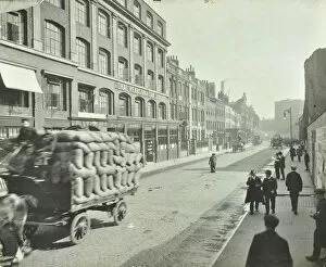 Cobblestone Gallery: Cart laden with sacks, Mansell Street, Stepney, London, 1914