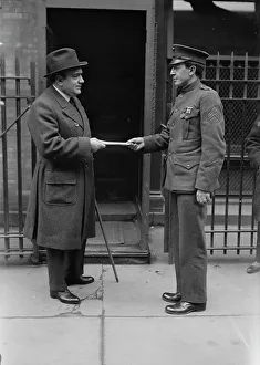 Giving Prints: Caruso greets a marine, between c1915 and c1920. Creator: Bain News Service