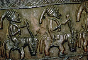 Nigeria Prints: A carved wooden door from Nigeria depicting men on horseback