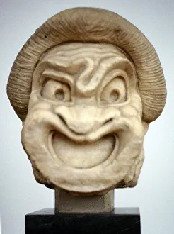 Carving of a mask used in Ancient Greek theatrical comedy, 3rd century BC