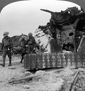 Armoured Warfare Gallery: Casualties from the front pass destroyed tanks, Villers-Bretonneux, France, World War I