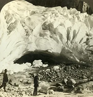 Cavernous mouth of huge Brigsdal glacier where melting ice forms mountain torrents Cavernous mouth of huge Brigsdal glacier where melting ice forms mountain torrents