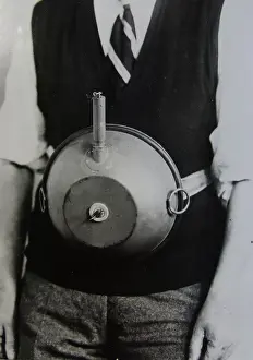 Research Prints: Cecil Vandepeer Clarke wearing an early version of the limpet mine on a keeper plate