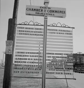 Mississippi United States Of America Prints: Chamber of Commerce sign, Drew, Mississippi, 1937. Creator: Dorothea Lange
