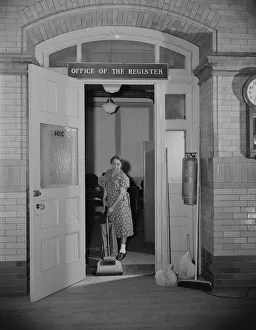 Office Gallery: Charwoman cleaning after regular working hours... Washington, D.C. 1942. Creator: Gordon Parks