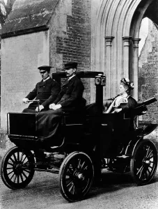 Elegance Prints: Two chauffeurs driving a convertible City and Suburban electric car