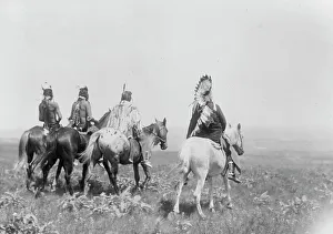 Apsaroke Prints: The chief and his staff, Apsaroke Indians, c1905. Creator: Edward Sheriff Curtis