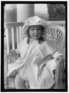 Embroidering Prints: Child, between 1913 and 1918. Creator: Harris & Ewing