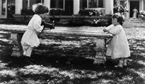 Photographic Prints 1890 1910 Gmgpc Prints: One child aiming camera, on bench