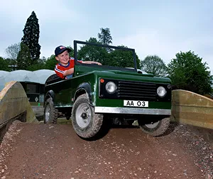 Kids Prints: Child driving a toy Land Rover