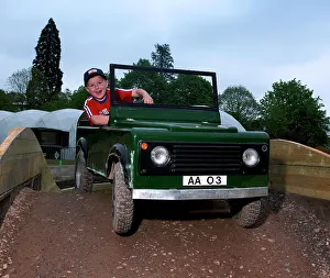 Off Road Prints: Child driving a toy Land Rover