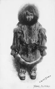 Inuit Prints: Child in fur outfit, between c1900 and c1930. Creator: Lomen Brothers