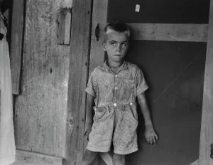 Dirty Prints: Child of sharecropper family near Cleveland, Mississippi, 1937. Creator: Dorothea Lange