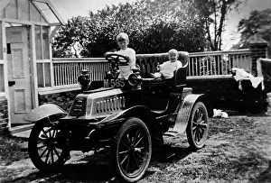Boy Racer Prints: A child at the wheel of a De Dion Bouton car, 1903