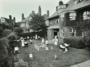 Hedge Gallery: Children and carers in a garden, Hampstead, London, 1960