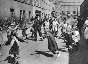 Children dancing in the street, London, 1926-1927