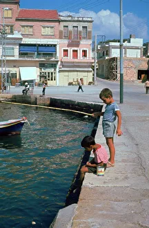 Children fishing in the harbour of Khania
