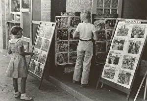 Saturday Prints: Children looking at posters in front of movie
