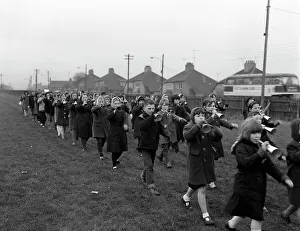 Blowing Your Own Trumpet Collection: Children marching with home made bugles, Middlesborough, Teesside, 1964