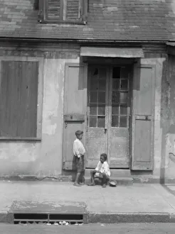 Shutters Prints: Two children outside a door with shutters in the French Quarter