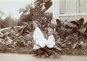 Images Dated 19th November 2009: Two children playing outdoors, 1890s