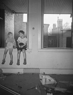 Destruction Collection: Children playing in wrecked houses along Independence Avenue, Washington, D. C, 1942