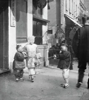 Chinese Americans Prints: Three children standing on a sidewalk