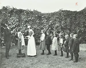 Weighing Scales Prints: Children being weighed in the garden, Montpelier House Open Air School, London, 1908