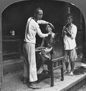 Bhamo Gallery: A Chinese barber at Bhamo, Burma, 1908. Artist: Stereo Travel Co