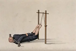 Confined Prints: A Chinese man confined to a contraption which ties his legs on to a wooden gallows whilst