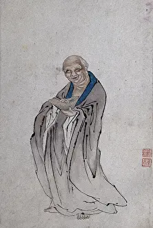 Friendly Prints: A Chinese man standing holding a long bowl with raised ends
