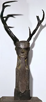 Half Beast Prints: Chinese wooden sculpture of an antlered head