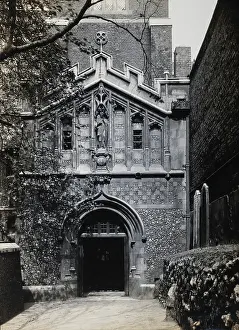 1902 Prints: The church of St Bartholomew the Great; exterior view showing the entrance through the west porch