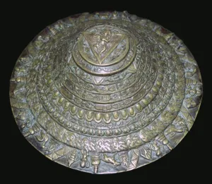 Circular plaque from Nepal with dancing figure, probably Chamunda Circular plaque from Nepal with dancing figure, probably Chamunda
