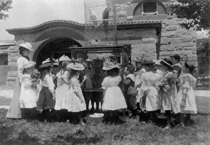 A class at the zoo - the bird cage, (1899?). Creator: Frances Benjamin Johnston