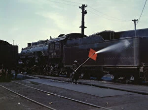 Engine Gallery: Cleaning an engine near the roundhouse, C. M. St. P. & P. R.R. Bensenville, Ill. 1943