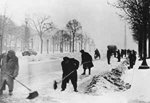 Clearing snow on the Champs Elysees, German-occupied Paris, winter, 1941