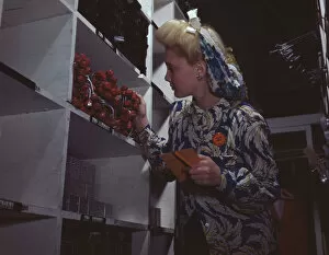 Headscarf Gallery: Clerk in one of the stock rooms of North American Aviation, Inc... Inglewood, Calif. 1942