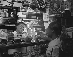 Grocers Prints: Clerk waiting on a customer in the store owned by Mr