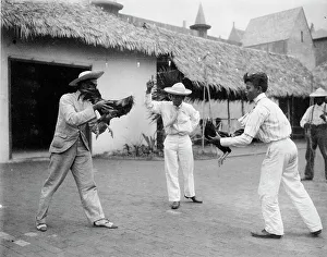 Two cock-fighters and referee at the World's Columbian Exposition, Chicago, Illinois, 1892 or 1893. Creator: Frances Benjamin Johnston