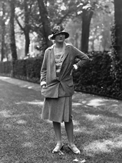 1929 Prints: Coco Chanel modeling a Chanel suit on rue Faubourg Saint-Honoré in Paris