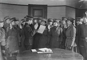 Colonel J.H. Wells swearing in woman motorist, 29 May 1917. Creator: Bain News Service