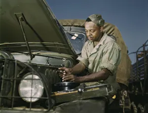 Military Base Prints: Colored mechanic, motor maintenance section, Ft. Knox, Ky. 1942. Creator: Alfred T Palmer