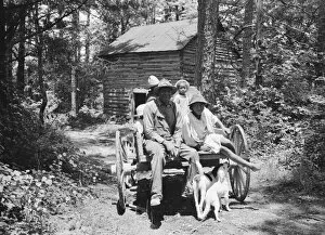 Carriage Gallery: Colored sharecropper and his children about to leave... Shoofly, North Carolina, 1939
