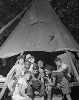 Camping Gallery: Comic papers, Camp Nathan Hale, Southfields, New York, 1943. Creator: Gordon Parks