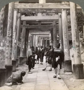 Images Dated 17th July 2008: Coming and going under long rows of sacred torii, Shinto temple of Inari, Kyoto, Japan, 1904