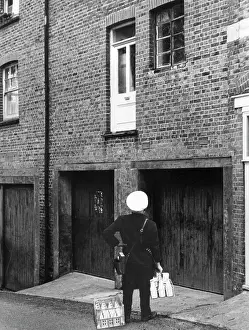 Doors Prints: Confused milkman confronted with a doorstep on the first floor
