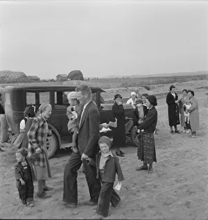 Congregation leaving after services, preacher in doorway, Dead Ox Flat, Oregon, 1939. Creator: Dorothea Lange