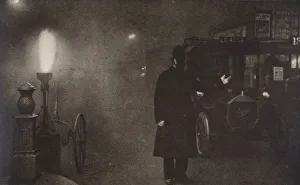 Streetlighting Prints: A constable directing traffic in the fog, London, c1910s-c1920s(?)